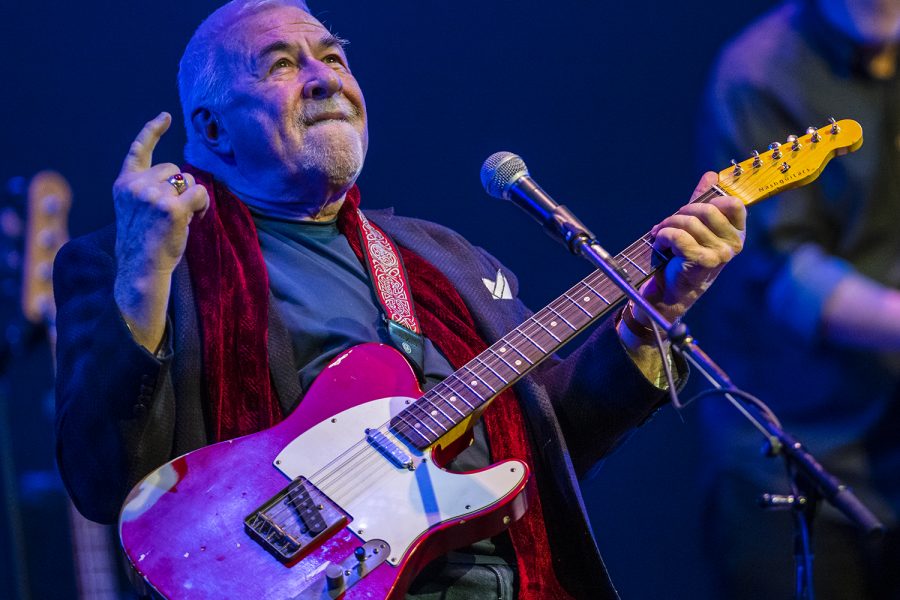 Musician Jim Byrnes playing guitar